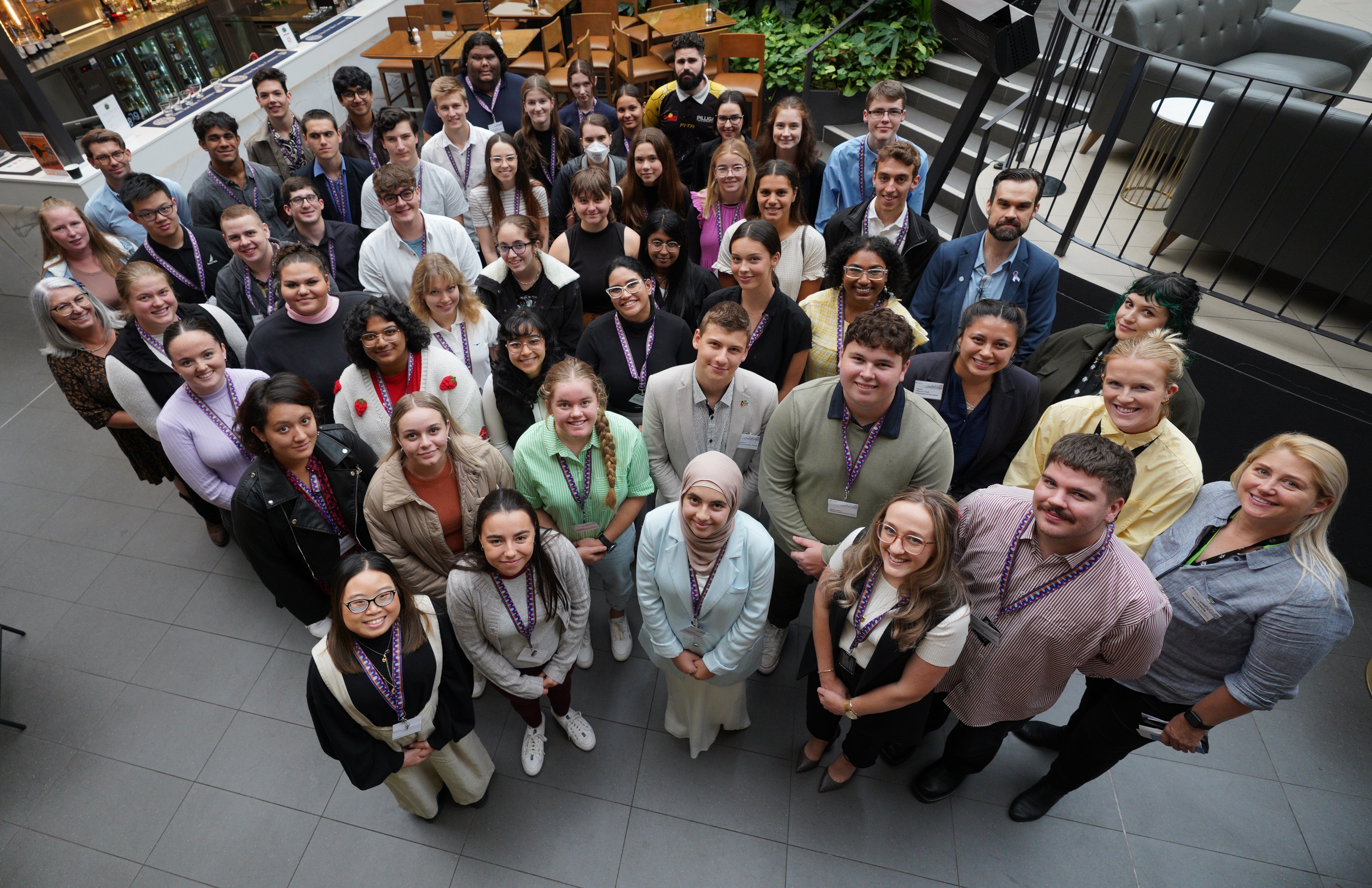 The Youth Advisory group standing in a courtyard looking up at the camera