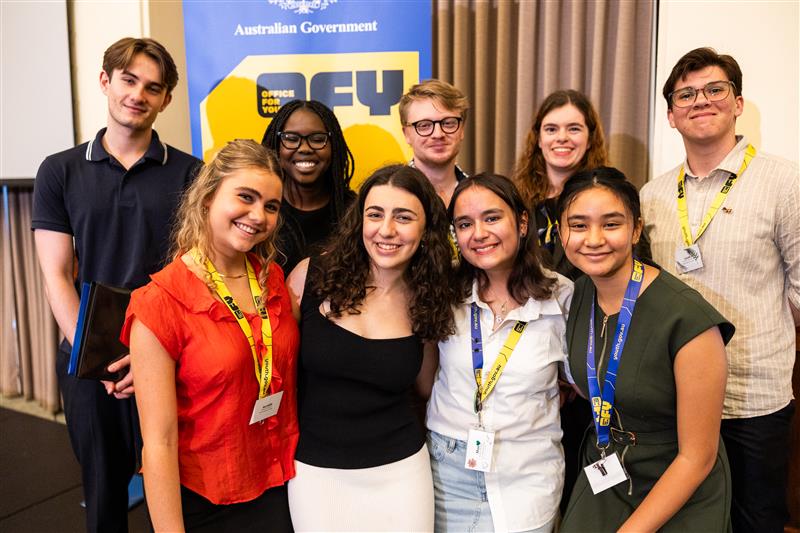 Youth advisory group of young people smiling.