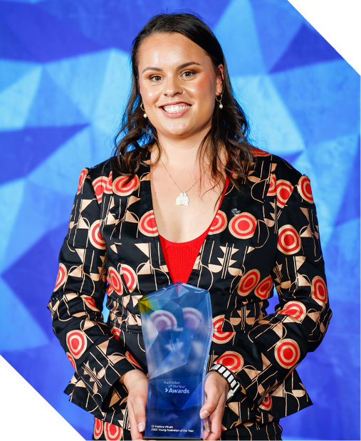 Dr Katrina Wruck holding an award