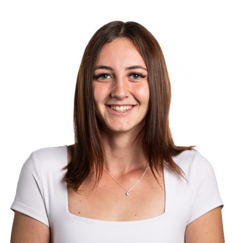 Image of Hailey smiling with shoulder length straight hair wearing a t-shirt.