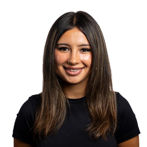 Image of Jindara smiling with long straight hair wearing a t-shirt.