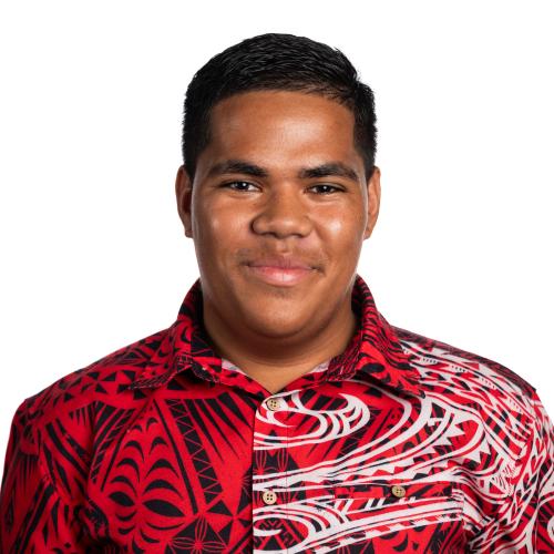 Image of Semisi smiling with short hair wearing a collared shirt.