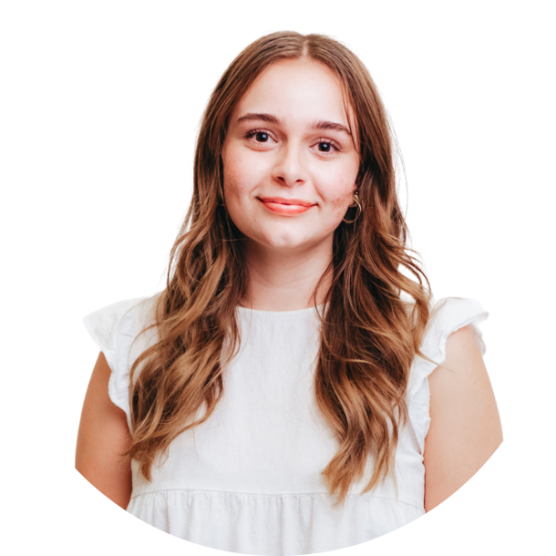 Charlotte - headshot of a smiling young woman with long brown hair wearing a white blouse.
