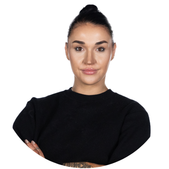 Young person wearing a long sleeved black shirt, with short black hair.