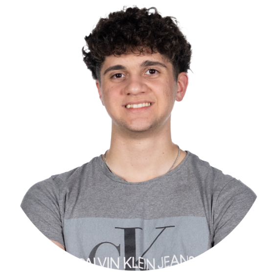 Young person wearing a grey tshirt, with short dark hair, smiling.